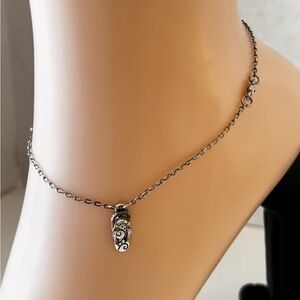 Brighton silver-toned anklet bracelet featuring a small flip-flop charm .